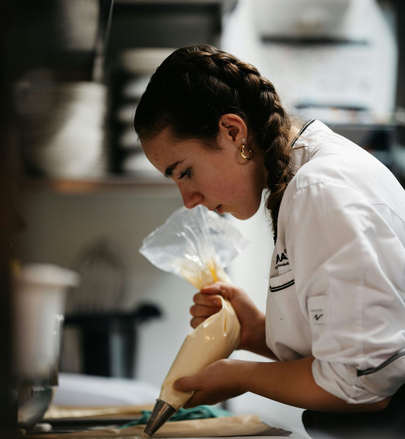 Young female chef in a kitchen